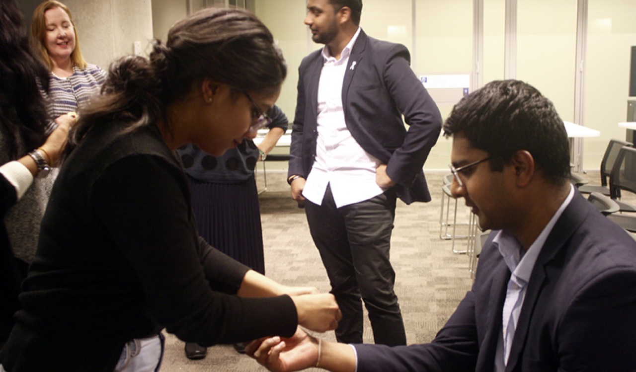 WR - Ms Suri tying Rakhi on Mr Kailyanda