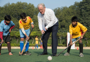 Minister for Trade and Investment Andrew Robb showing-off his hockey prowess at a sports clinic during his visit to New Delhi for Australia Business Week in India.